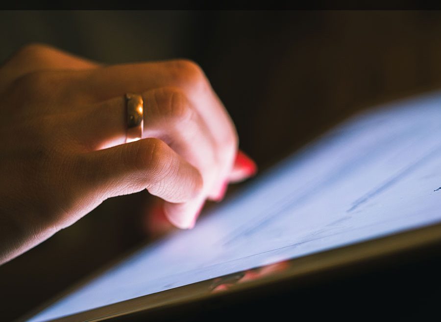 Woman filling out Police report on a tablet computer