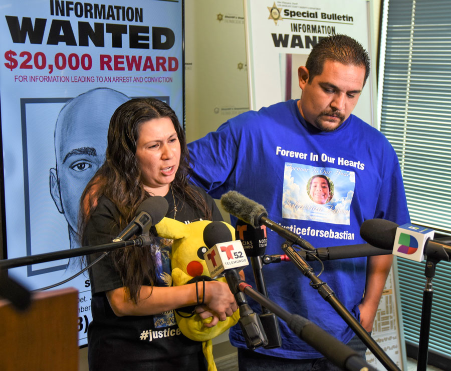 Emotional Falcon family speaking to press