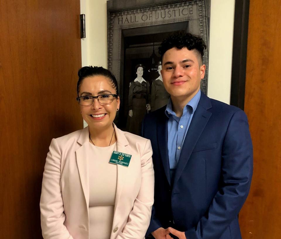 Luis standing next to Captain Lorena Rodriguez of Sheriff's Information Bureau. 